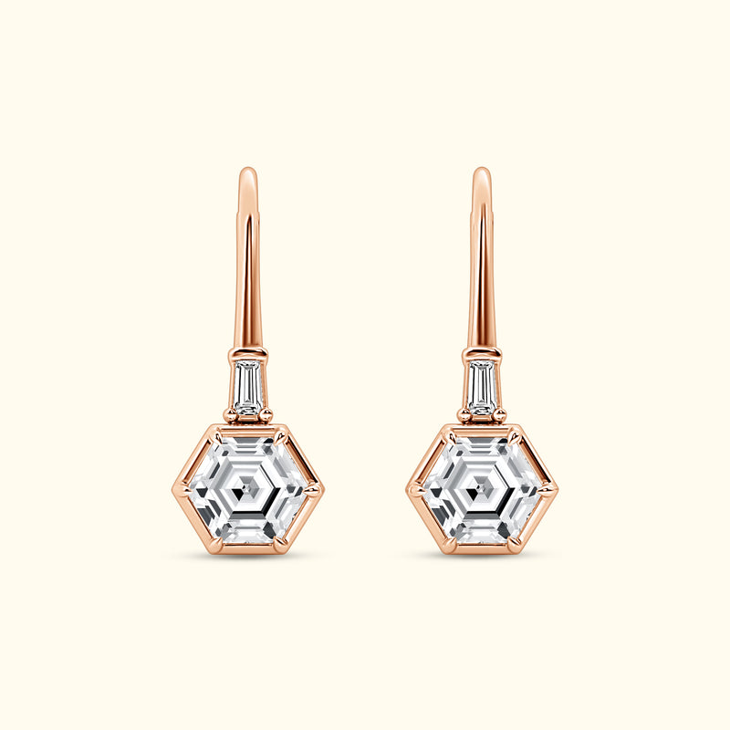 Elegant hexagonal earrings with clear stones, set in rose gold.