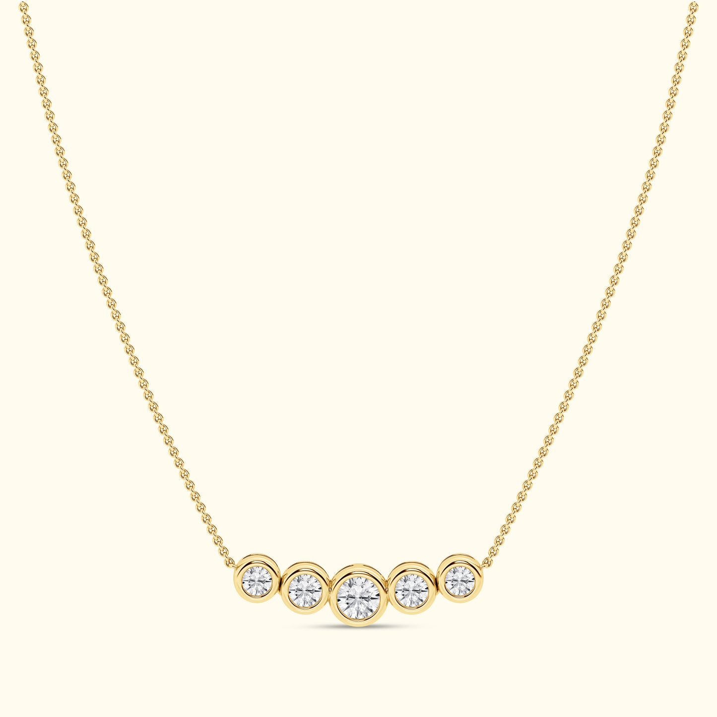 Gold necklace featuring five round diamonds arranged in a horizontal line.