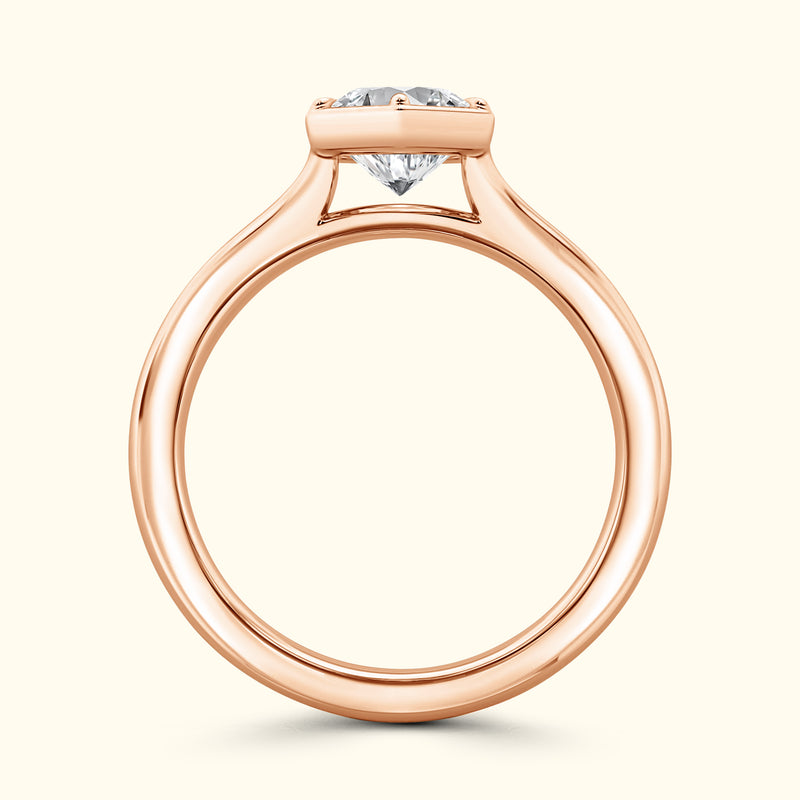 Rose gold engagement ring featuring a sparkling diamond at the center.