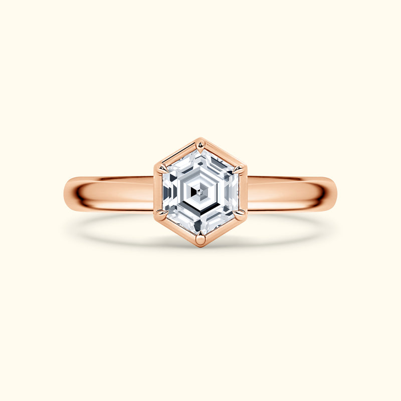 Rose gold ring featuring a hexagonal diamond centerpiece in a delicate setting.
