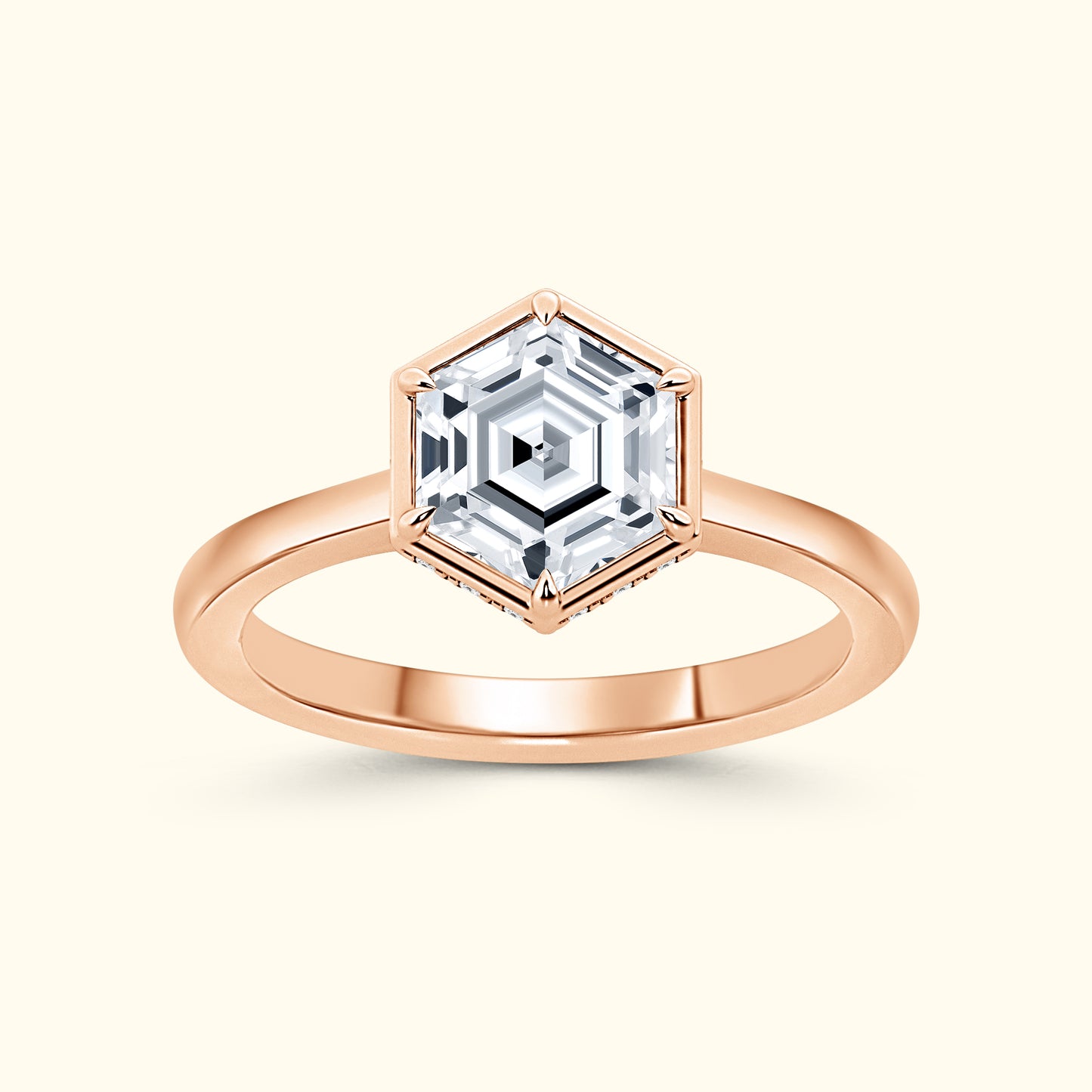 Rose gold ring featuring a hexagonal, faceted gemstone at the center.