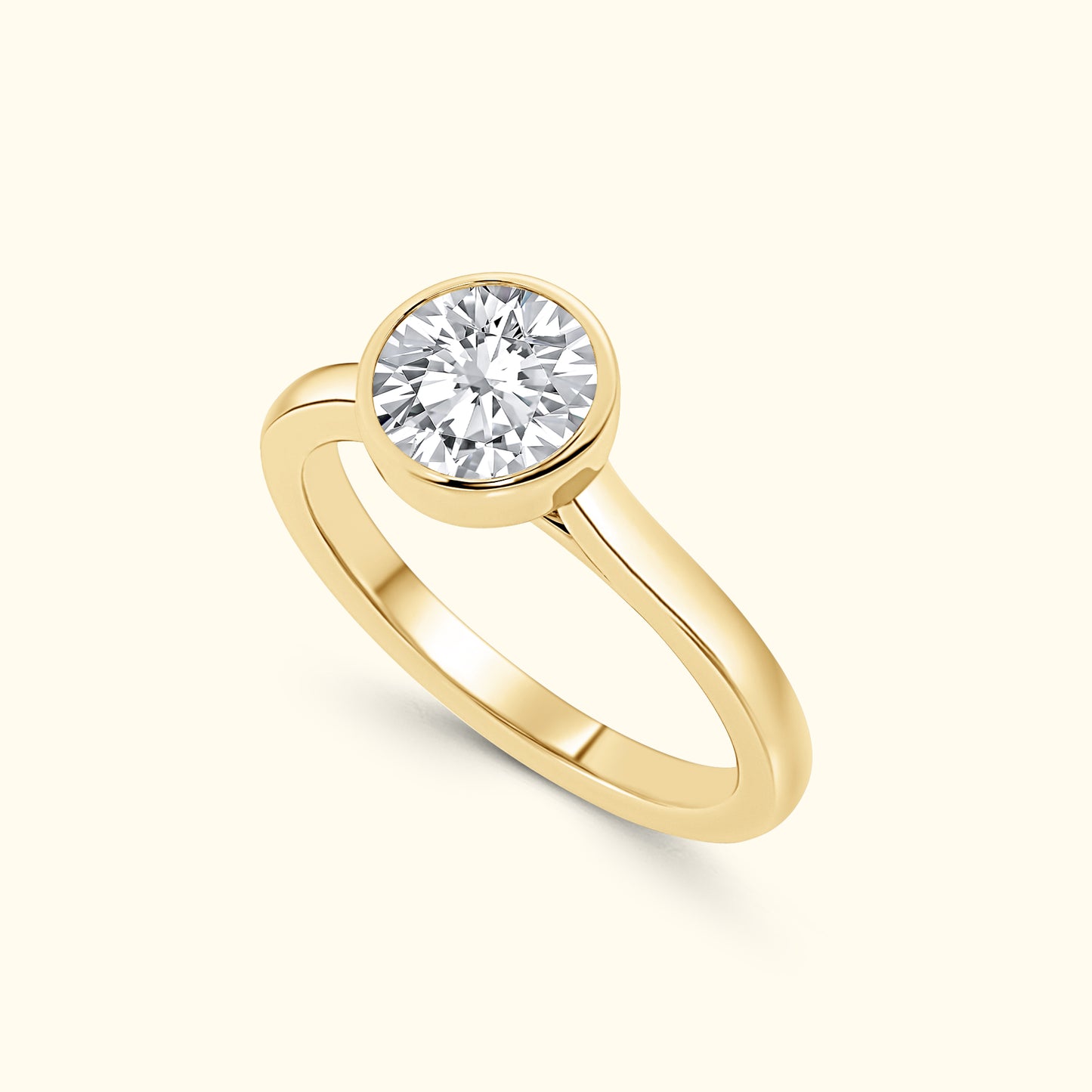 A simple gold ring featuring a large round diamond at the center.