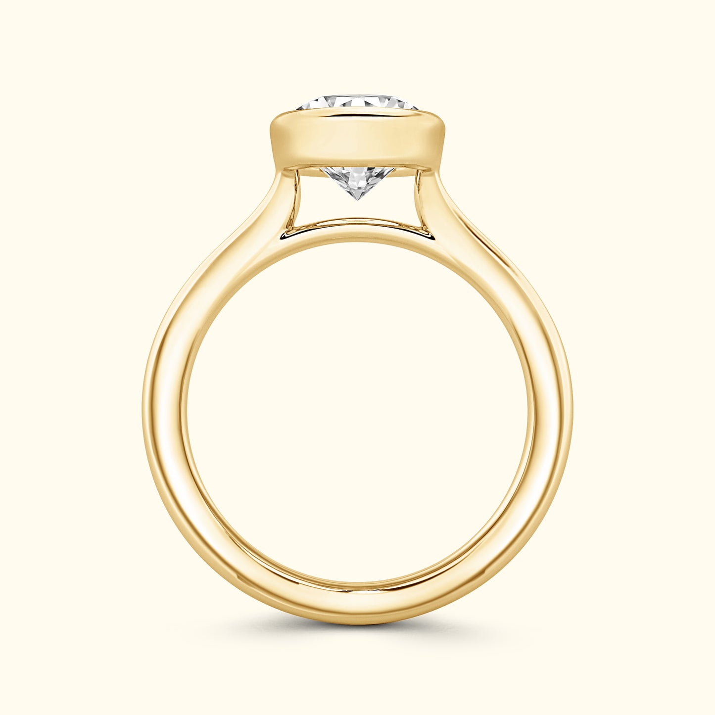 Elegant gold engagement ring featuring a large round diamond centerpiece.