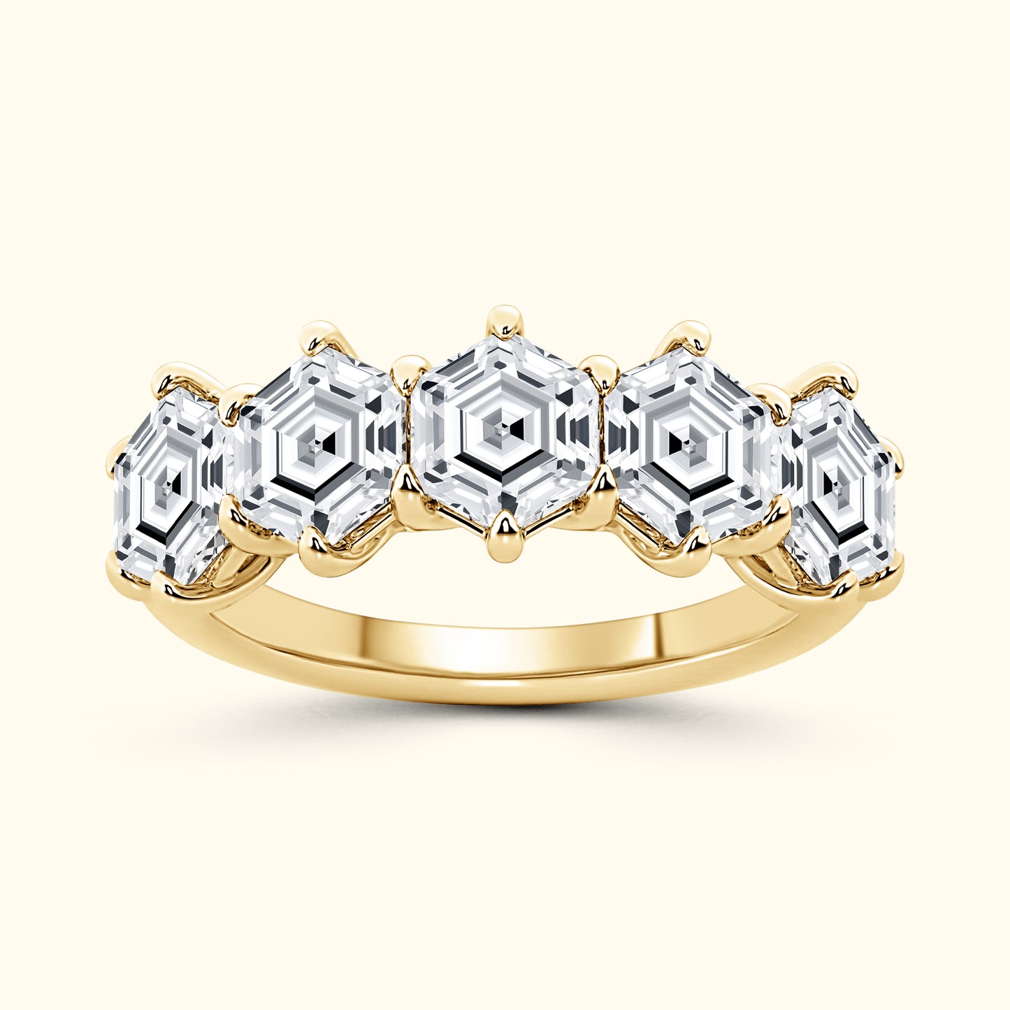 Gold ring featuring five hexagon-shaped clear stones set in a pronged design.