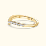 Gold ring with a twisted design and small diamonds set along the band.
