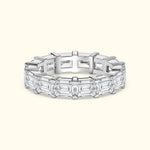 Elegant diamond band featuring alternating emerald-cut diamonds in a sleek setting.