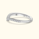 Elegant silver ring with a twisted band and small diamonds along one side.