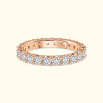 Rose gold ring set with sparkling diamonds around the band.