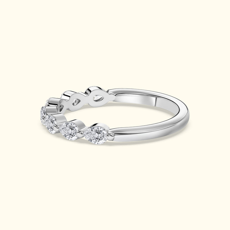 Elegant silver ring featuring three sparkling diamonds in a wavy design.