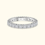 Diamond-accented silver band with a scalloped edge.