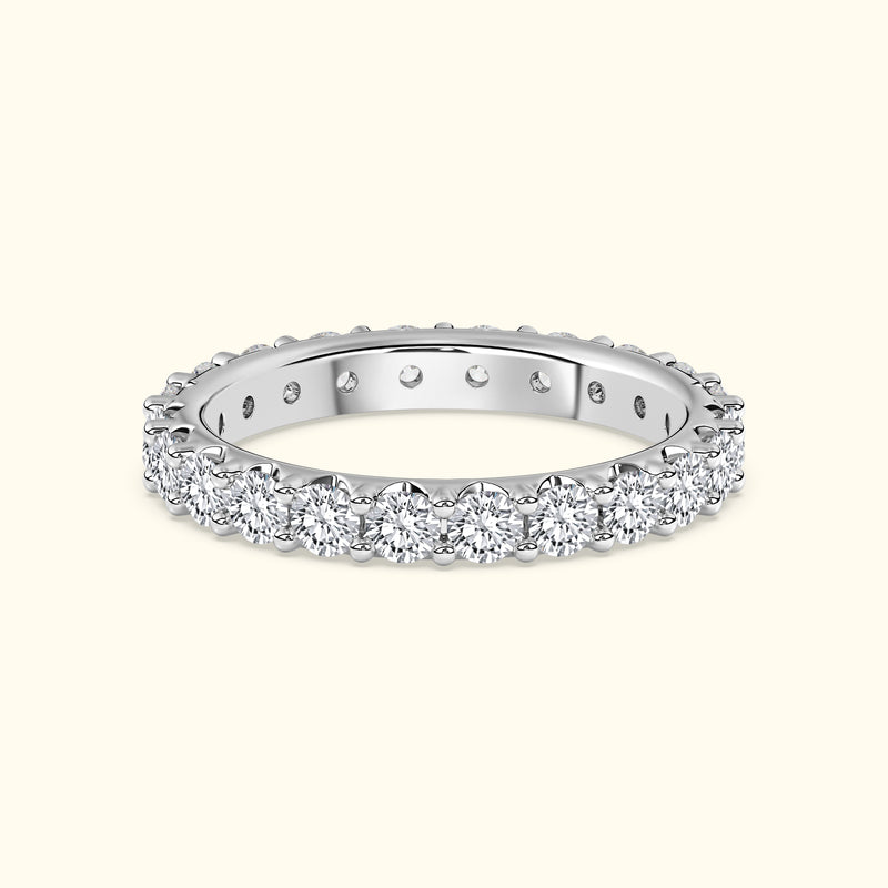 Diamond-accented silver band with a scalloped edge.