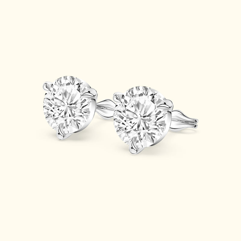 Elegant diamond stud earrings set in white gold with four-prong settings.