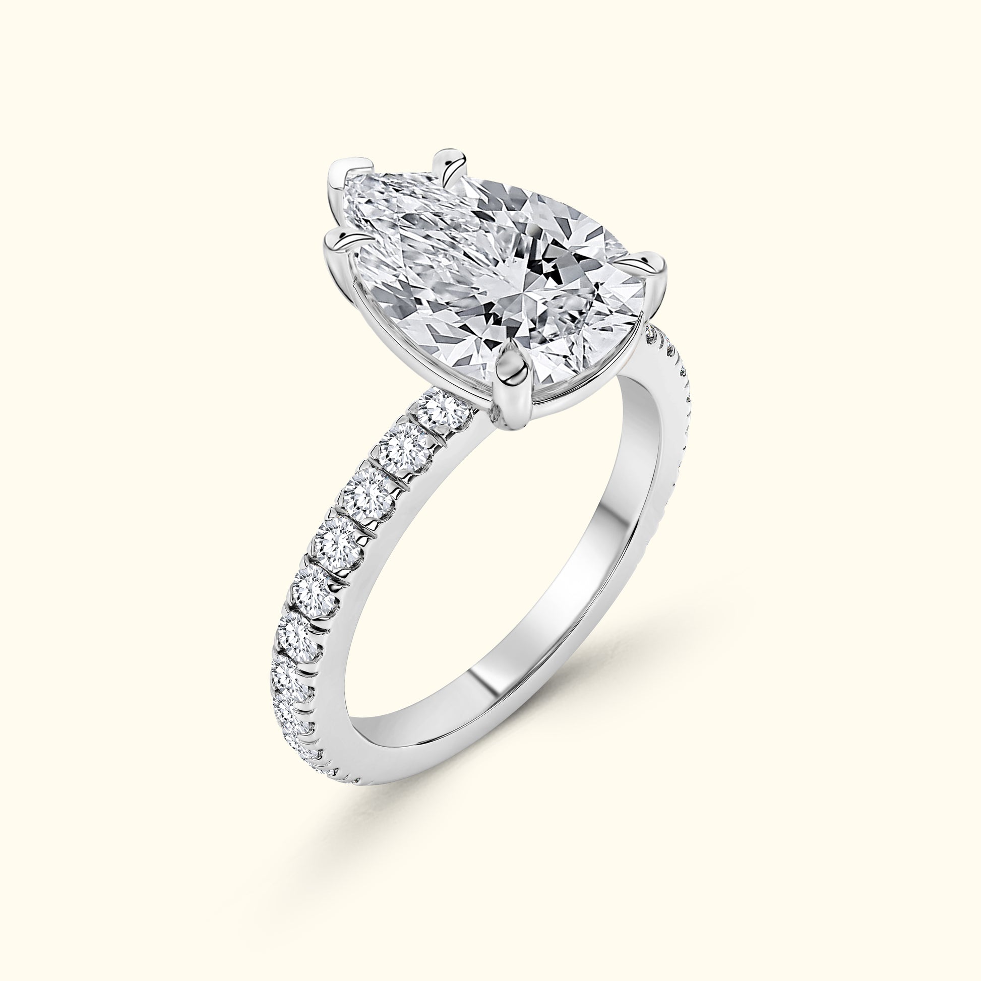 Elegant silver ring featuring two sparkling diamonds and a band set with smaller diamonds.