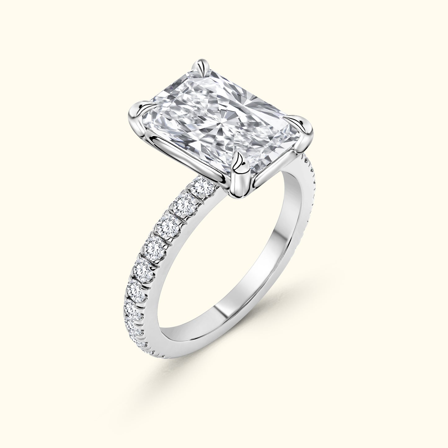 Elegant rectangular diamond ring with a band adorned in small stones.