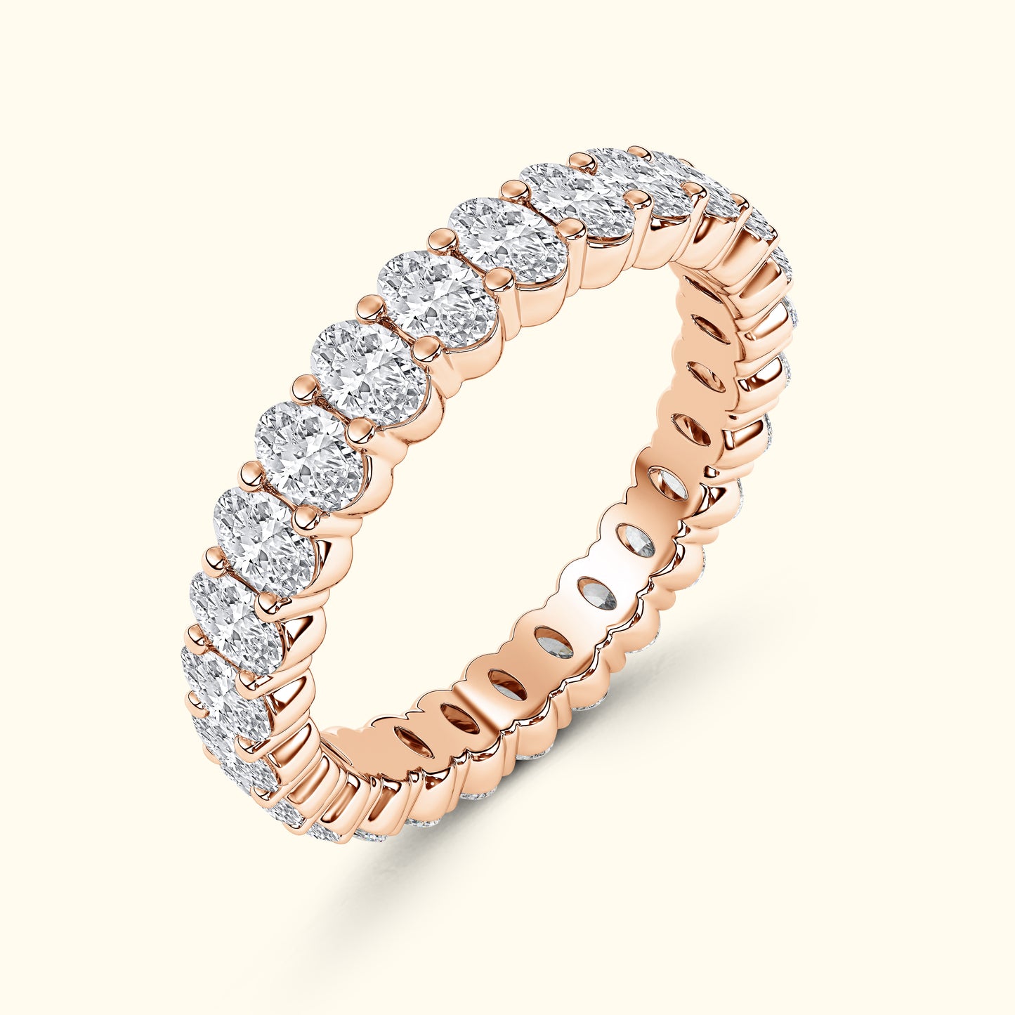 Rose gold eternity ring set with sparkling round diamonds.