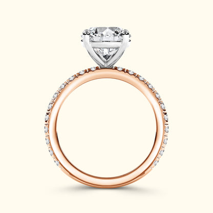 Rose gold engagement ring featuring a large sparkling diamond and smaller side stones.