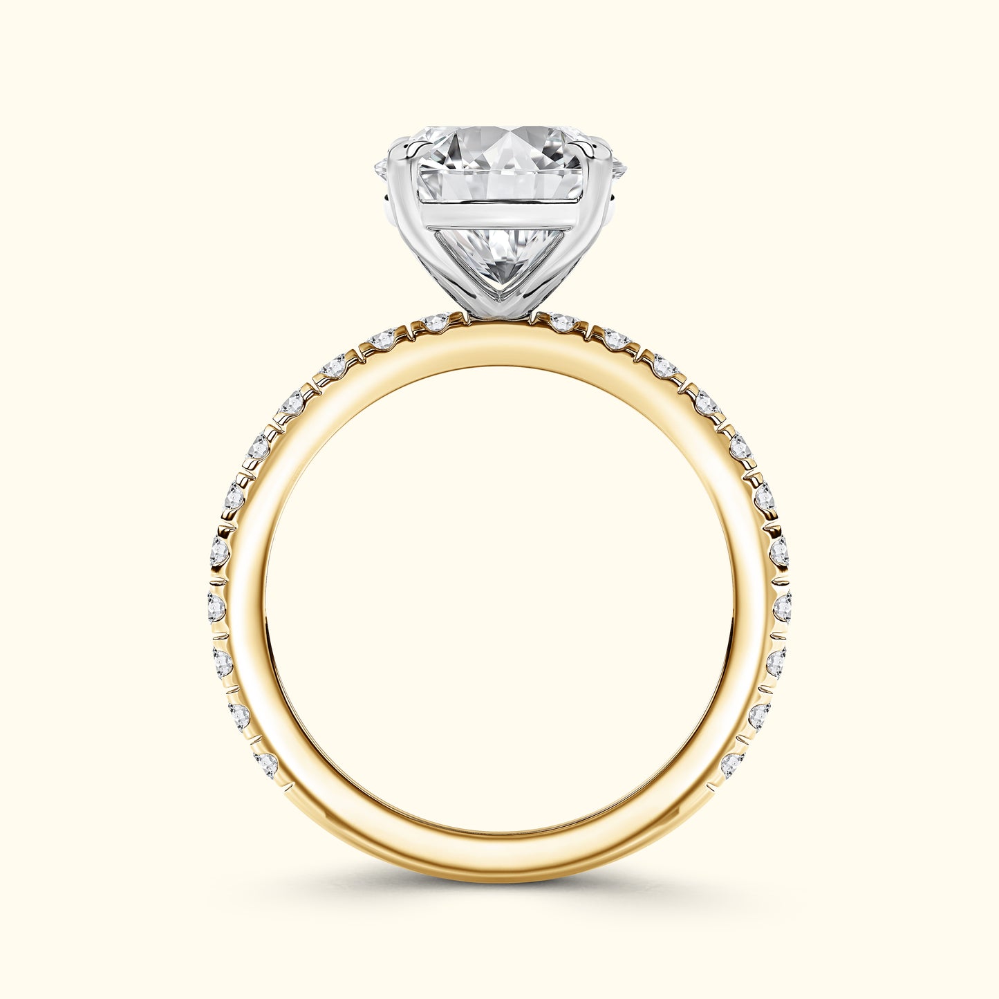 Gold and white gold engagement ring featuring a heart-shaped diamond.