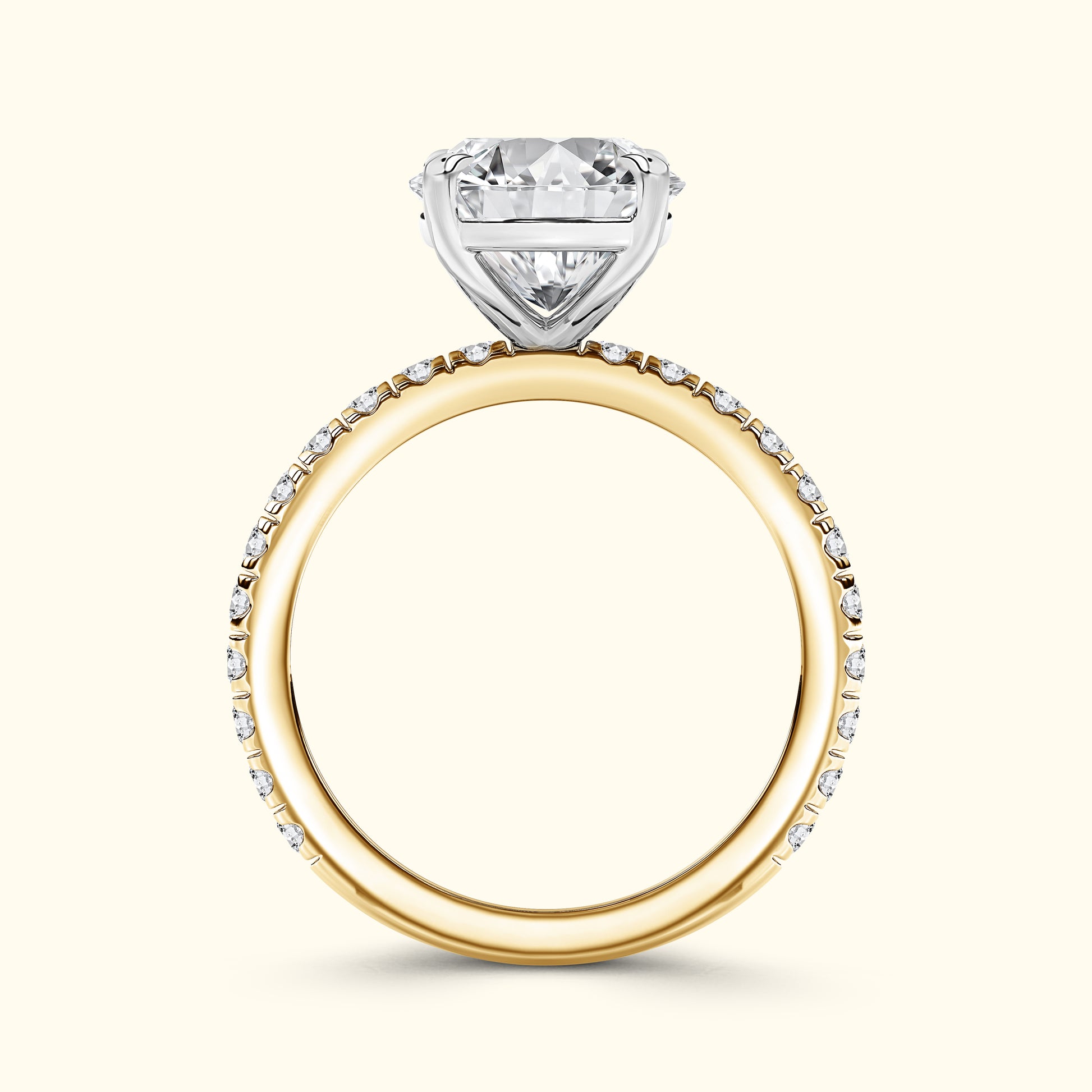 Gold and white gold engagement ring featuring a heart-shaped diamond.