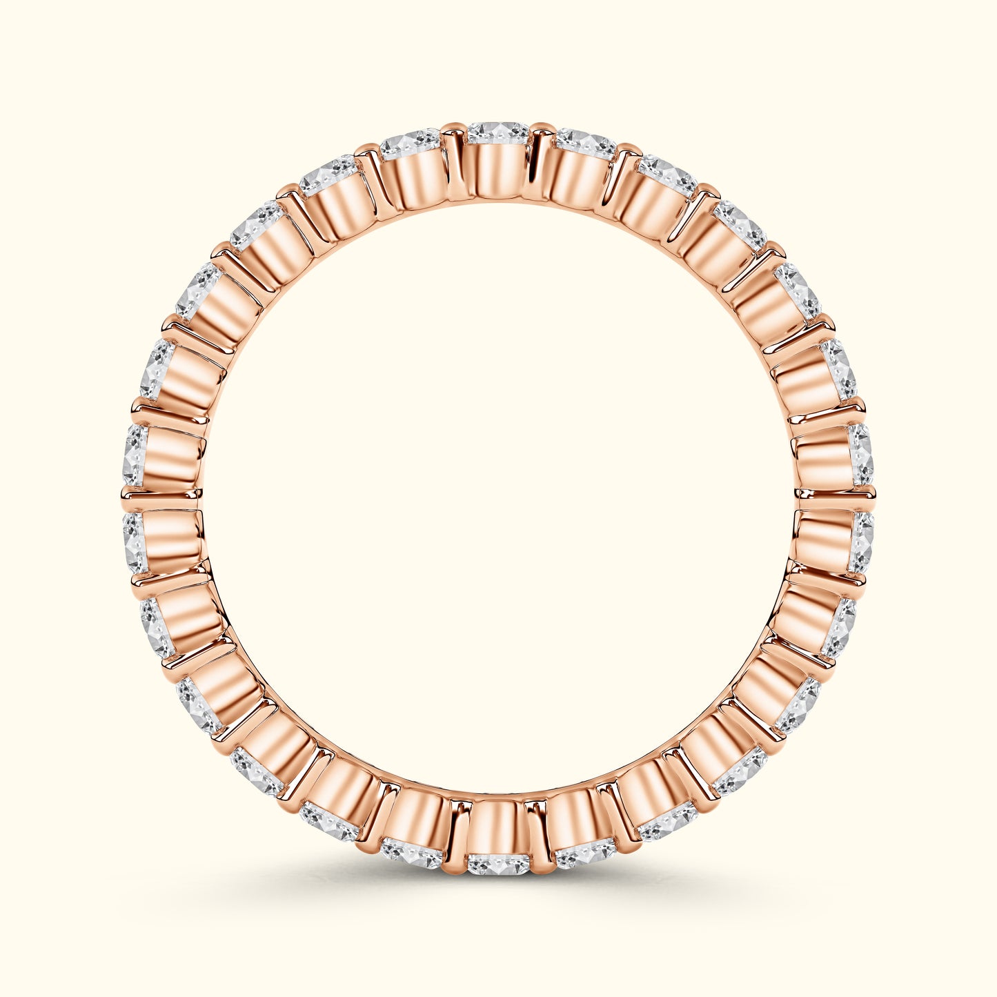 Rose gold band with alternating diamond and gold accents, elegantly circular.