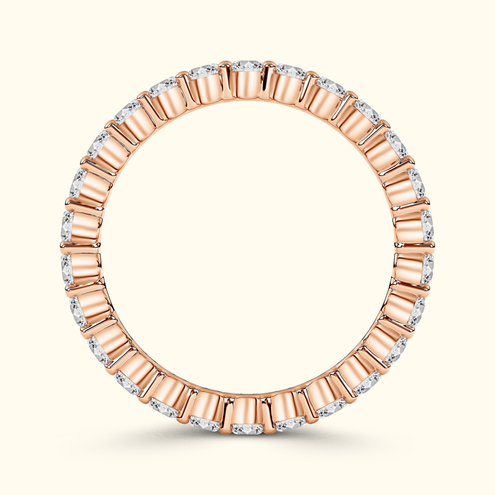 Rose gold band with alternating diamond and gold accents, elegantly circular.