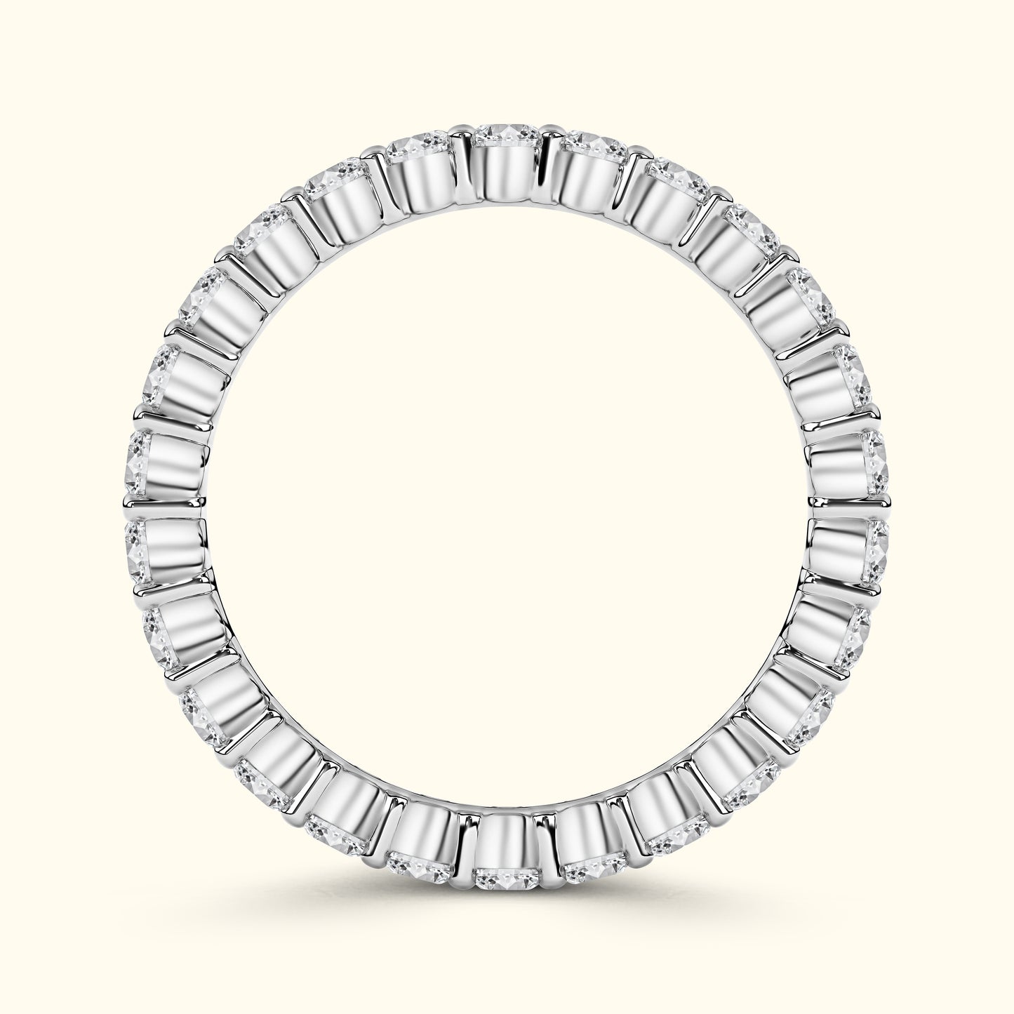 Elegant round ring featuring alternating baguette and round diamonds in a white gold setting.