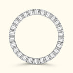 Elegant round ring featuring alternating baguette and round diamonds in a white gold setting.