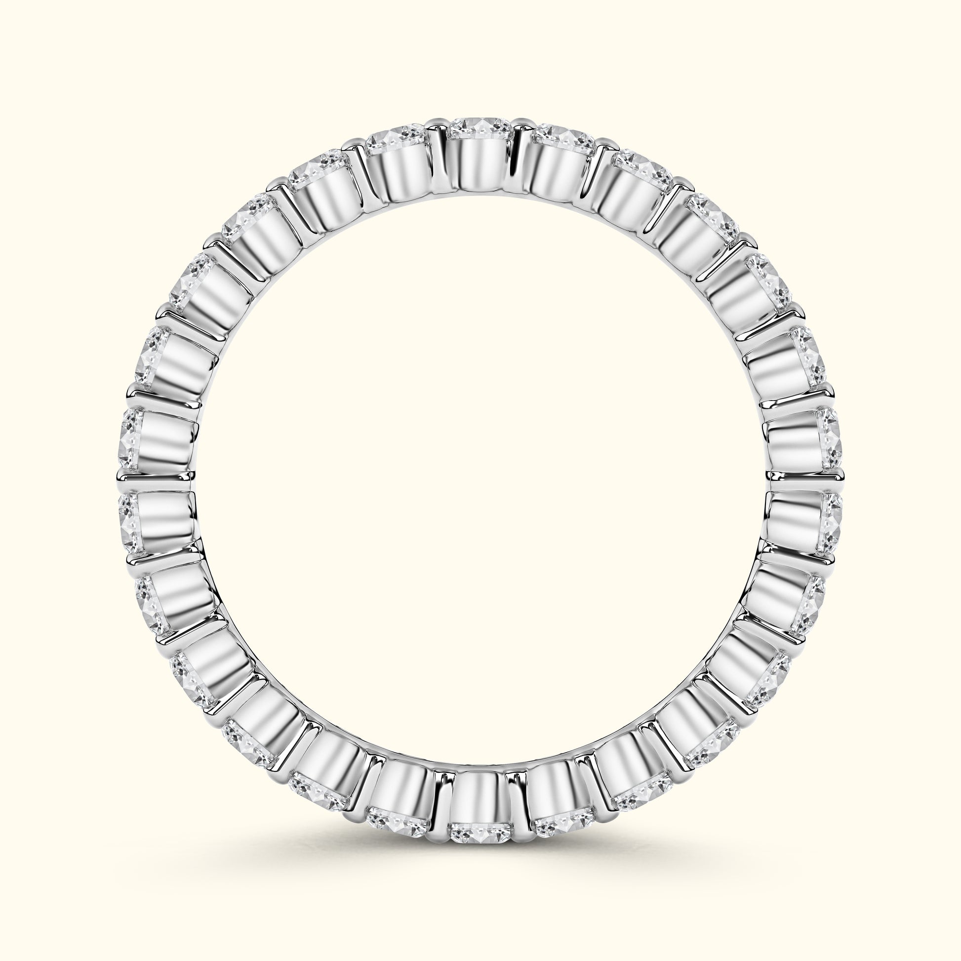 Elegant round ring featuring alternating baguette and round diamonds in a white gold setting.