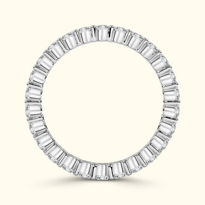 Elegant round ring featuring alternating baguette and round diamonds in a white gold setting.