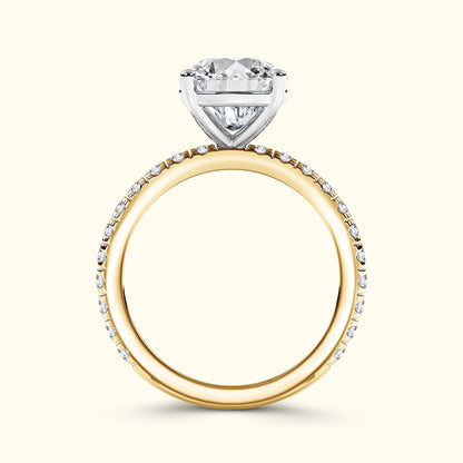 A two-tone engagement ring featuring a heart-shaped diamond setting on a gold band.