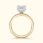 Elegant two-tone engagement ring featuring a diamond centerpiece and a sparkling band.