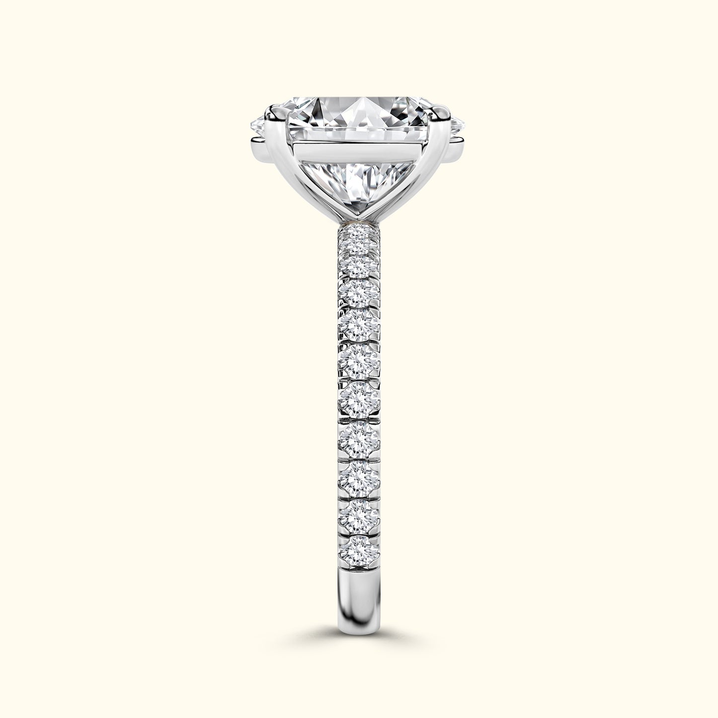 Elegant diamond engagement ring with a prominent center stone and a delicate band of smaller diamonds.