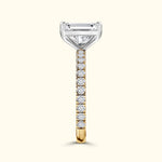 Elegant gold and silver ring setting featuring a large diamond centerpiece and smaller side diamonds.