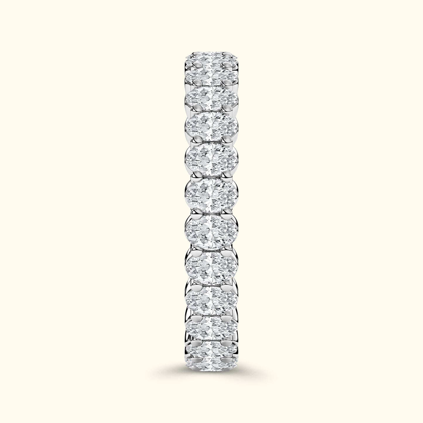 A vertical row of sparkling diamond rings set in a sleek silver band.