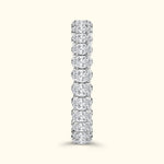 A vertical row of sparkling diamond rings set in a sleek silver band.