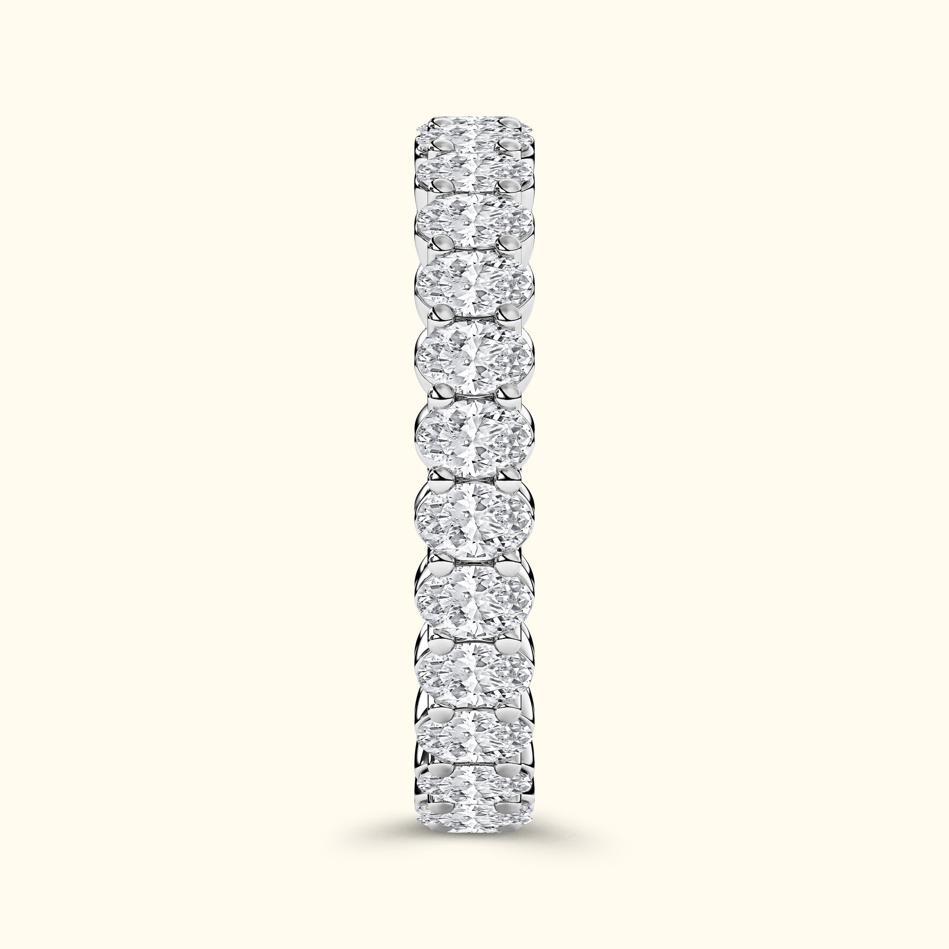 A vertical row of sparkling diamond rings set in a sleek silver band.