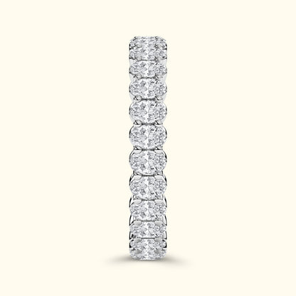 A vertical row of sparkling diamond rings set in a sleek silver band.