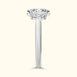 Solitaire diamond ring with a sleek band and a prong-set round diamond on top.