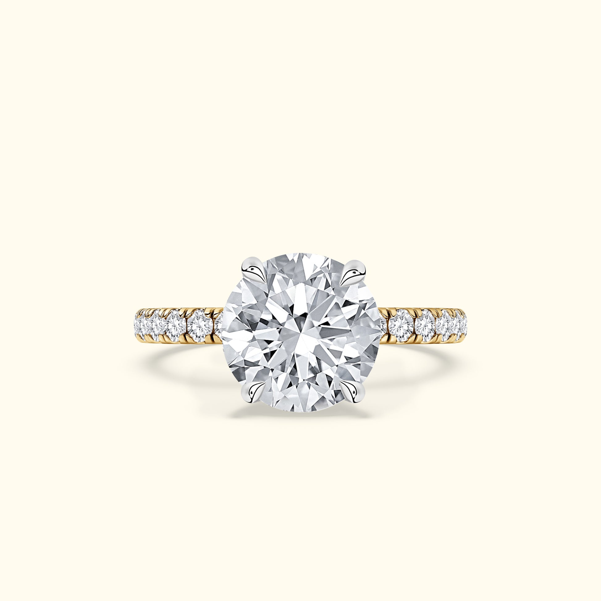 Solitaire diamond ring with a round diamond center and a delicate gold band.