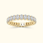 Gold band ring featuring a series of oval diamonds set in a row.