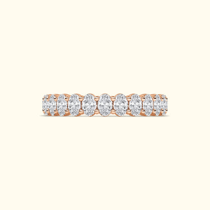 Rose gold ring featuring a line of oval diamonds.