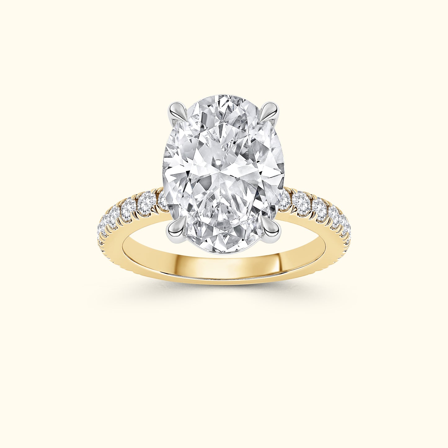 Oval diamond ring with a yellow gold band and smaller accent diamonds.