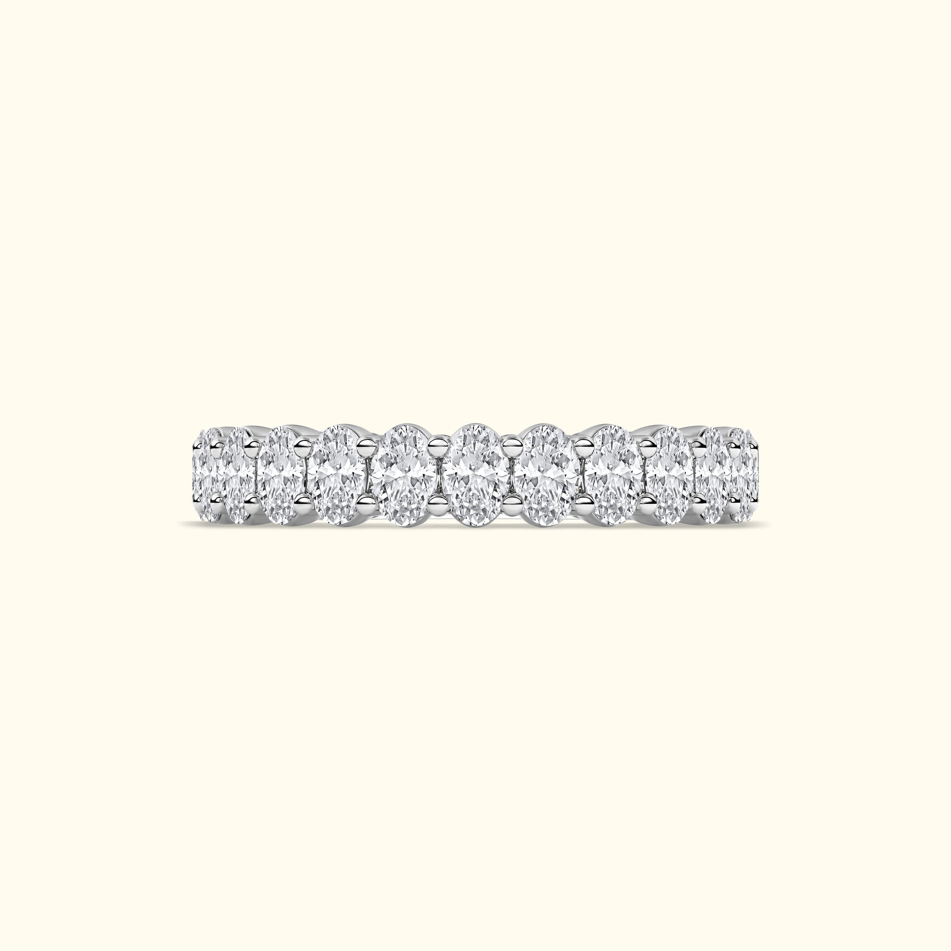 A shimmering diamond band featuring oval-cut diamonds set in a sleek platinum setting.