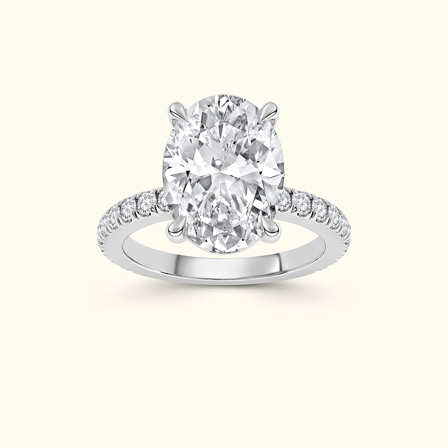 Sparkling oval-cut diamond ring with delicate side stones on a white gold band.