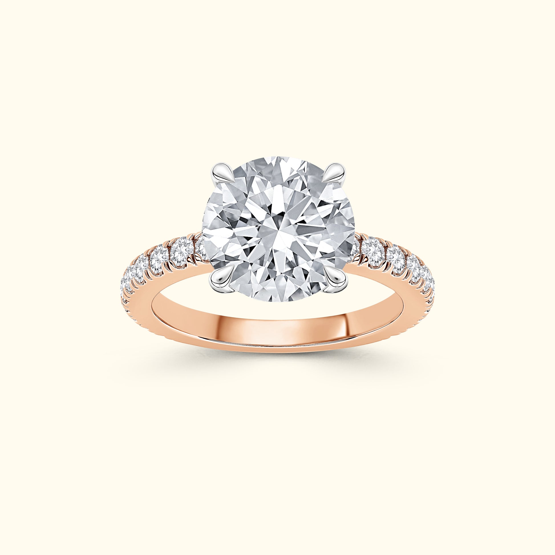 Rose gold engagement ring featuring a large round diamond and smaller diamonds along the band.