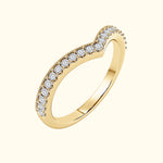 Elegant gold ring with a wavy design, adorned with sparkling diamonds.