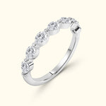 Elegant silver ring adorned with five sparkling oval diamonds.