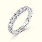 Diamond eternity ring with a row of sparkling round stones set in a polished band.