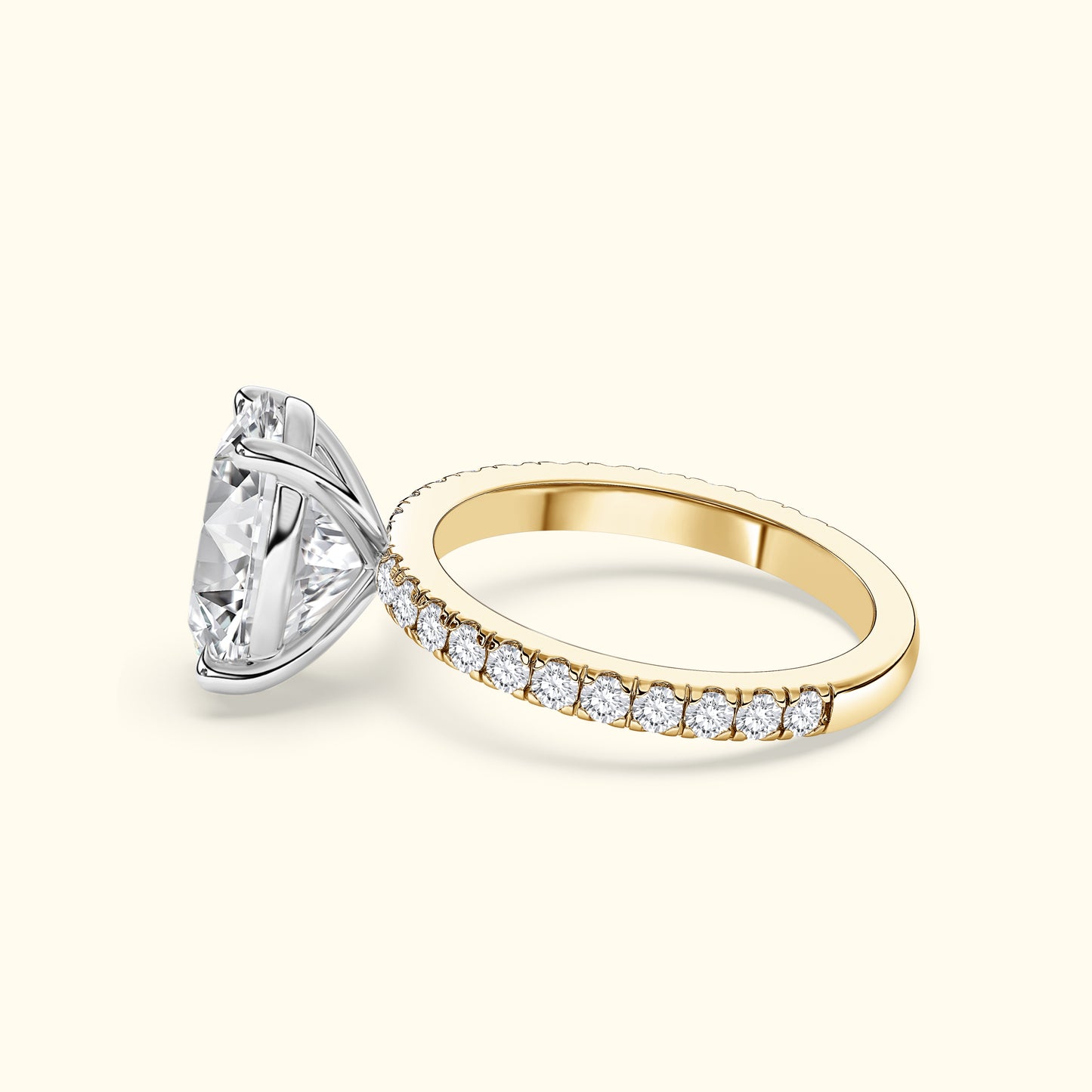 Elegant two-tone engagement ring with a large diamond center and smaller stones on the band.