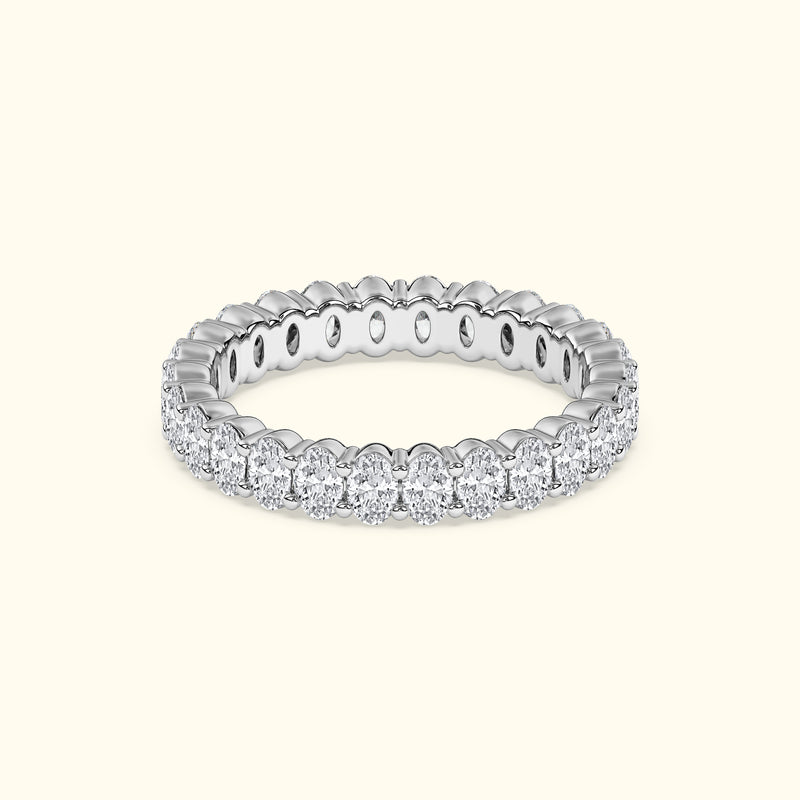 Elegant silver band ring adorned with sparkling round diamonds.