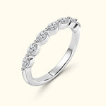 Elegant silver band ring set with five sparkling round diamonds.